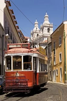Images Dated 19th August 2009: A tram runs along the tourist friendly Number 28 route in Alfama, Lisbon