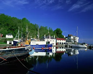 Canal Prints: Tranquil scene of boats reflected in still water on the Crinan Canal