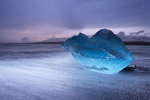 Images Dated 24th September 2008: Translucent blue iceberg washed ashore on Breidamerkursandur black sands