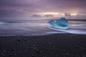 Images Dated 24th September 2008: Translucent blue iceberg washed ashore on Breidamerkursandur black sands