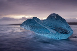 Images Dated 24th September 2008: Translucent blue iceberg washed ashore on Breidamerkursandur black sands