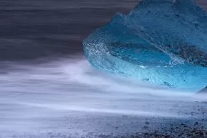 Images Dated 24th September 2008: Translucent blue iceberg washed ashore on Breidamerkursandur black sands
