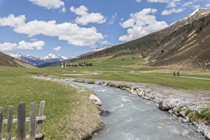 Cycling Prints: Transparent water of river around the alpine village of Davos