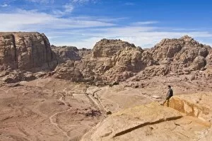 Images Dated 4th November 2009: Traveller enjoying the view over Petra, UNESCO World Heritage Site, Jordan, Middle East