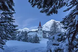 Chiesa Bianca Prints: Tree branches covered in snow trying to hide the tiny church at the Maloja Pass