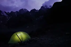 Tajikistan Prints: Trekker's tent lit inside at night in the remote and spectacular Fann Mountains