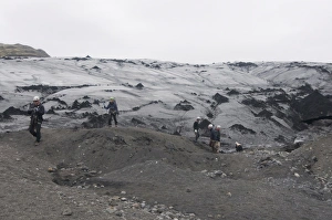 Walkers Prints: Trekkers walking above the Solheimajokull glacier, Iceland, Polar Regions