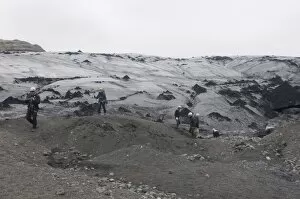 Trekkers walking above the Solheimajokull glacier, Iceland, Polar Regions