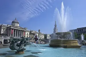 Trafalgar Square Prints: Tritons and dolphin fountain with the Olympic digital countdown clock and the National Gallery