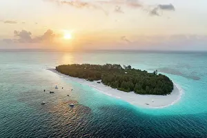 Lagoons Prints: Tropical island washed by the crystal water of the exotic lagoon at sunrise