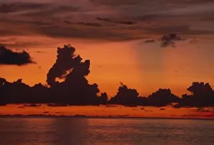 Dramatic Skies Collection: Tropical sunset off Seven Mile Beach, Cayman Islands, West Indies, Central America