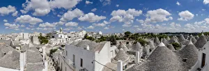Apulia Prints: Trulli traditional stone huts and Itria Valley in summer, Alberobello