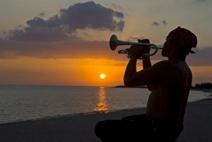 Musicians Prints: Trumpet player at sunset, Playa Ancon, Trinidad, Cuba, West Indies, Caribbean