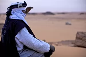 Images Dated 26th January 2010: A Tuareg dressed for celebrations at the entrance of the Dar Sahara tented camp in the Fezzan