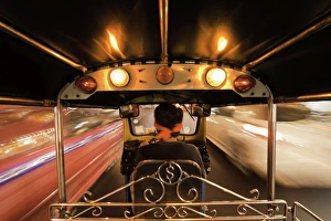 Thai Culture Prints: Tuk-tuk (auto rickshaw) in motion at night, Bangkok, Thailand, Southeast Asia, Asia