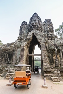 Taxi Prints: Tuk-tuks driving through the South Gate at Angkor Thom