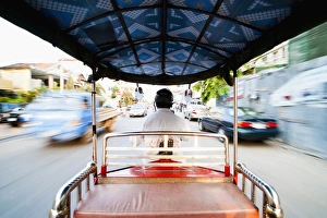 Tuk Tuk Prints: Tuktuk driver speeding along the roads of Phnom Penh