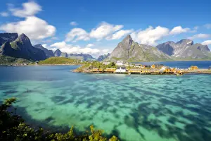 Sakrisoy Prints: The turquoise sea frames the typical fishing village surrounded by rocky peaks, Sakrisoy