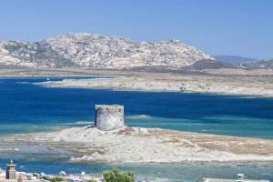 Province Of Sassari Prints: Turquoise sea and old tower surround La Pelosa Beach, Stintino, Asinara National Park