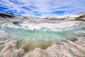 Turquoise water of Lake Andossi during thaw, Chiavenna Valley, Spluga Valley, Sondrio province