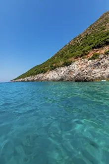 Albania Prints: Turquoise waters meet rocky coastline on a bright summer day near Dhermi in Albania