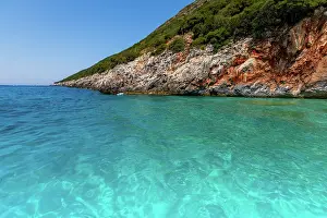 Enjoyment Prints: Turquoise waters meet rocky coastline near Dhermi in Albania on a bright summer day