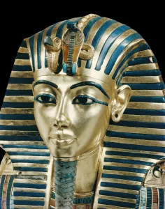 Tutankhamuns funeral mask in solid gold inlaid with semi-precious stones Tutankhamuns funeral mask in solid gold inlaid with semi-precious stones