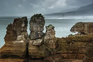 Punakaiki Prints: Twin Rock Formations at Pancake Rocks Against a Moody Sky in Punakaiki