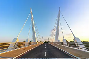 Support Prints: Twin-swing cable-stayed bridge connects two sides in Glasgow during sunset hours