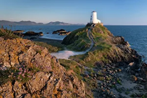 Guidance Gallery: Twr Mawr lighthouse on Llanddwyn Island backed by the Lleyn Peninsula, near Newborough, Anglesey
