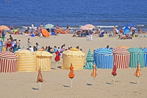 Normandie Prints: Typical color striped beach cabins, tourists, beach and sea, Trouville sur Mer, Normandy