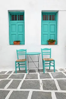 Chairs Prints: Typical Greek cafe table and chairs with shuttered windows, Pano Chora, Serifos, Cyclades