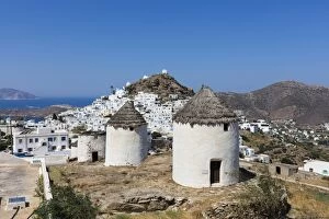 Thatch Collection: A typical Greek village perched on a rock with white and blue houses and quaint windmills
