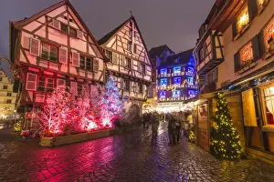 Christmas Tree Prints: Typical houses enriched by Christmas ornaments and lights at dusk