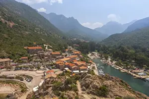 Southern Corsica Prints: The typical village and harbor of Porto immersed in the green vegetation of the promontory
