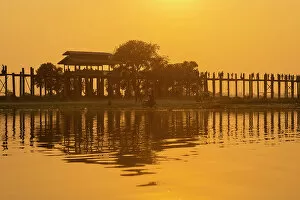 Connections Gallery: U Bein bridge over Taungthaman Lake at sunset, Amarapura, Mandalay, Myanmar (Burma), Asia
