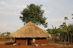 Uganda Prints: Ugandan child outside his home, Bweyale, Uganda, Africa