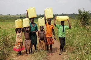 Children Prints: Ugandan children fetching water, Masindi, Uganda, Africa