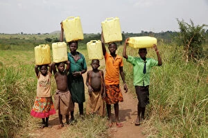 Rural Scenes Gallery: Ugandan children fetching water, Masindi, Uganda, Africa