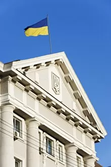 Ukrainian flag atop classical architecture, Kiev, Ukraine, Europe