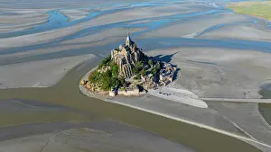 Roads Prints: UNESCO site Mont St. Michel shows its unique structure and surrounding tidal flats in France from a high view