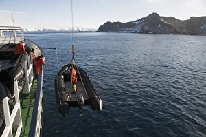 Unloading zodiac for landing on Gourdin Island, Antarctic Peninsula, Antarctica Unloading zodiac for landing on Gourdin Island, Antarctic Peninsula, Antarctica