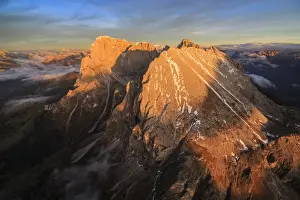 Langkofel Prints: The unmistakable profiles of Sassopiatto (Plattkofel) and Sassolungo (Langkofel) lit by the warm light of the sunset