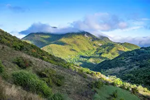 Fresh Prints: Untouched mountain scenery with hills, clouds, and greenery in South Ossetia, Russia