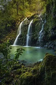 Upper Waikani Falls (Three Bears Falls) in soft sunset light catching early evening mist