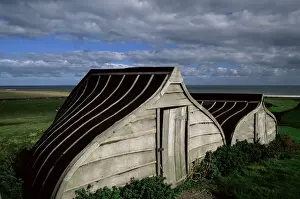 Upturned boats used as sheds, Lindisfarne (Holy Island), Northumbria, England