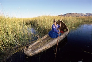 Paddling Prints: A Uros Indian woman in a traditional reed boat