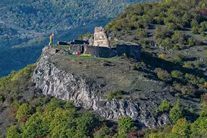National Prints: Vanati Castle on a hill in South Ossetia with green trees and a clear sky in the background