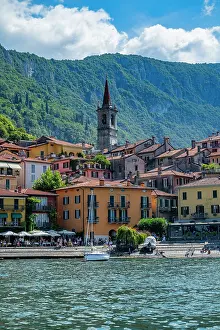 Varenna Prints: Varenna offers views of lakeside buildings and mountains near Lake Como in Italy during a sunny day