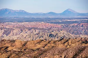 Vista Prints: Vast landscape view of Gorafe badlands featuring mountains and valleys under a clear sky in Andalusia